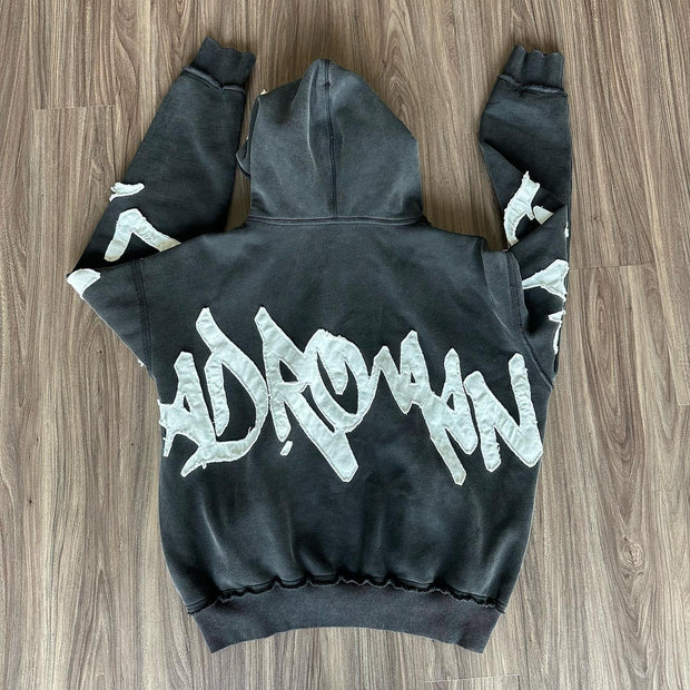 Stylish zippered hoodie with statement patches