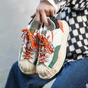 Dissolved shell toe color block shoes