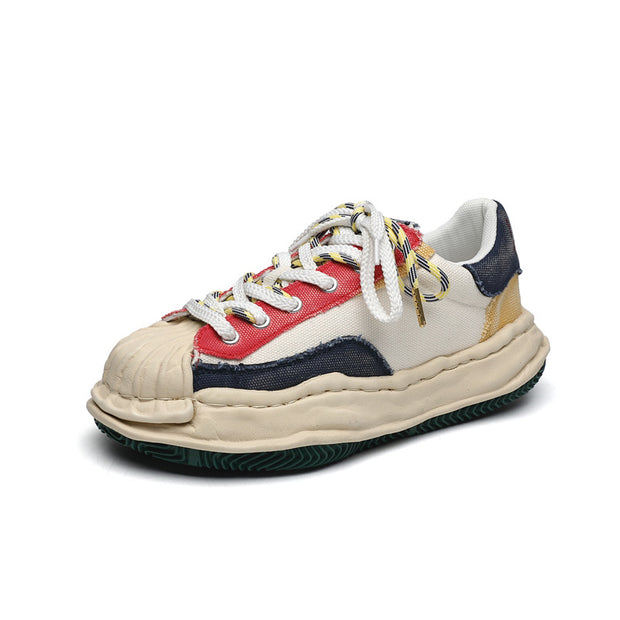 Dissolved shell toe color block shoes